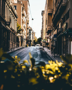 Surface level of street amidst buildings in city