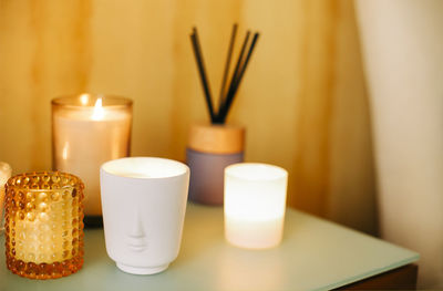 Close-up of candles on table