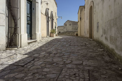 Narrow alley amidst buildings in city