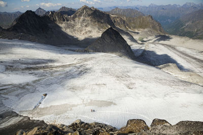 Hikers cross snowbird glacier, talkeetna mountains, alaska