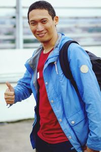 Portrait of young man standing outdoors