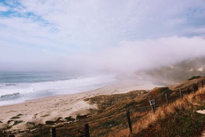 Scenic view of beach against sky