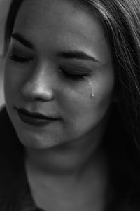 Close-up of sad young woman crying