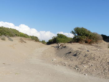 Scenic view of arid landscape against sky