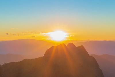 Scenic view of mountains against sky during sunset