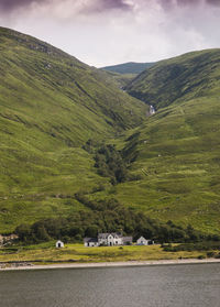 Countryside landscape against mountain range