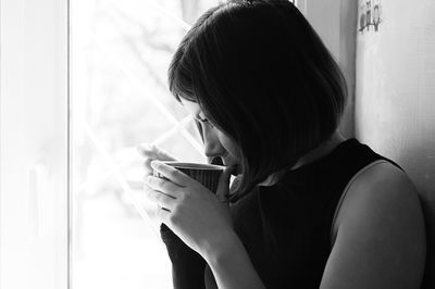 Woman holding coffee cup