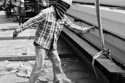 Full length of man standing by railway bridge