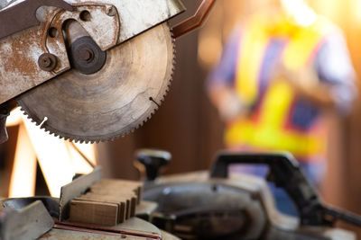 Close-up of worker working on wood
