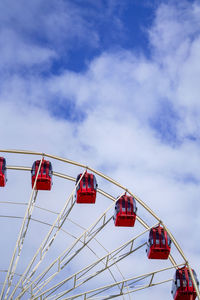 Low angle view of ferris wheel against sky