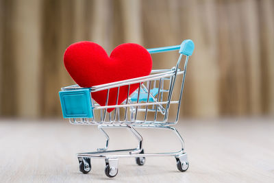 Close-up of red heart shape on table