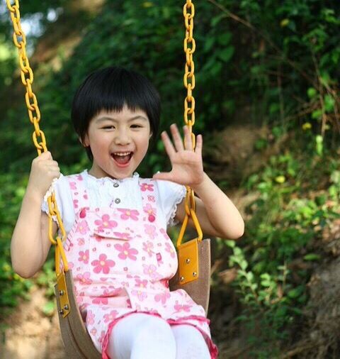 child, swing, playground, girls, one girl only, smiling, one person, happiness, park - man made space, childhood, people, fun, outdoors, portrait, beauty, frowning, cheerful, schoolyard, human body part, close-up, day