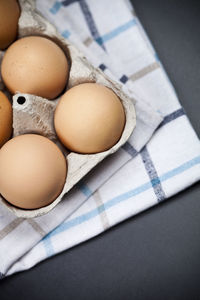 Close-up of eggs in carton