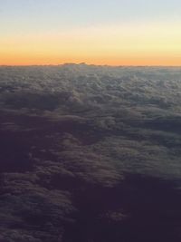 Scenic view of landscape against dramatic sky