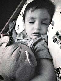 Portrait of cute boy relaxing on sofa