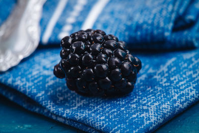 Close-up of black berries on table