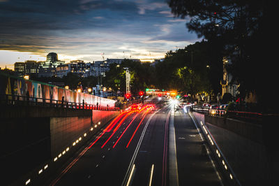 Light trails on road in city at night