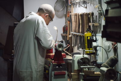 Mature man working at workshop