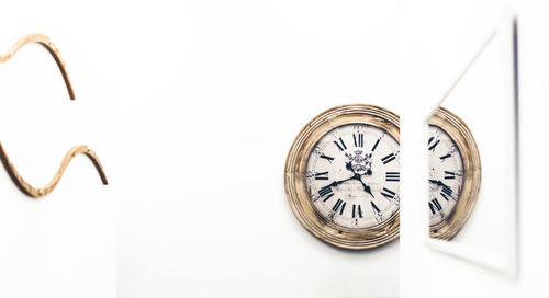 Close-up of clock against white background