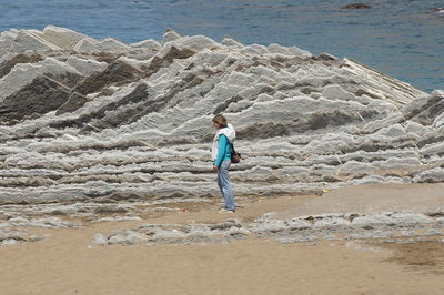 Full length of man on beach against sky