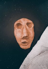 Directly above shot of human face shaped clay on table