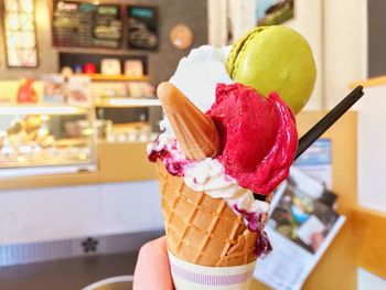 Close-up of hand holding ice cream