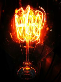 Close-up of illuminated light bulb