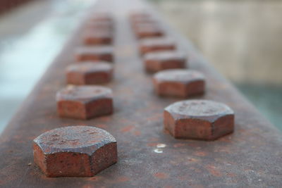 Close-up of rusty bolts on metal