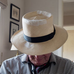 Senior man wearing hat at home