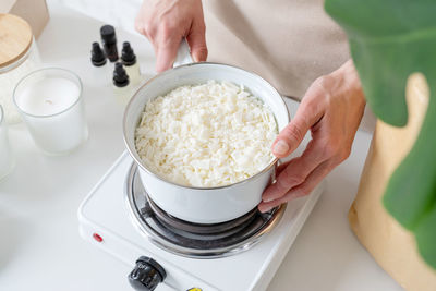 Cropped hand of person preparing food