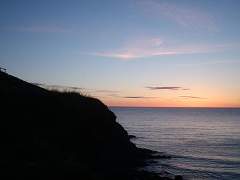Scenic view of sea against sky at sunset