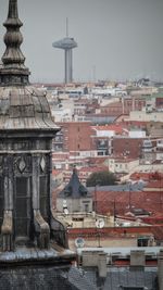 Buildings in city against sky