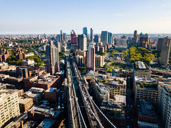 High angle view of street amidst buildings in city against sky