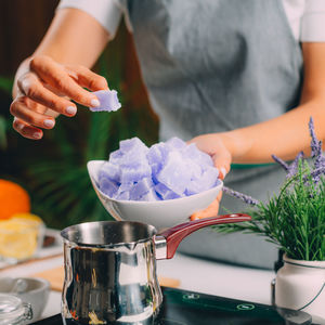 Close-up of hand holding ice cream