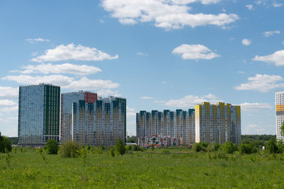 Buildings in city against sky