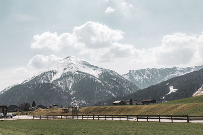 Scenic view of snowcapped mountains against sky