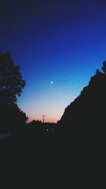 Silhouette landscape against clear sky