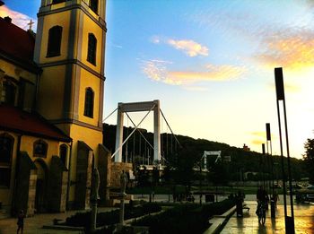 Buildings against sky at sunset