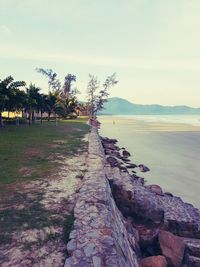 Scenic view of swimming pool by sea against sky