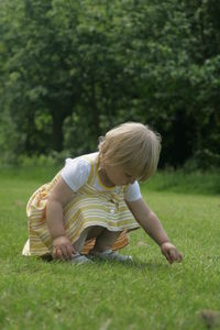 Rear view of child on field