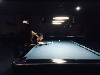 Man playing pool at home