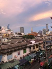 High angle view of buildings against sky during sunset