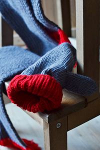 Close-up of knit hat and scarf on table