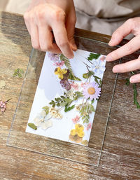 High angle view of woman holding bouquet of people