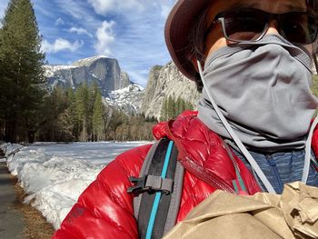 Midsection of person in mountains during winter