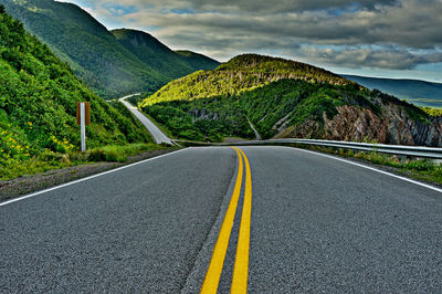 Surface level of country road against mountain range