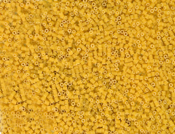 Raw yellow pasta close up. background. texture. top view. food.