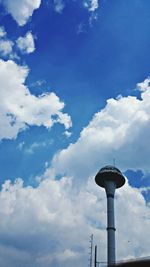 Low angle view of communications tower against sky