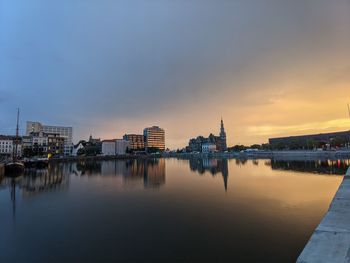 Buildings in city at sunset