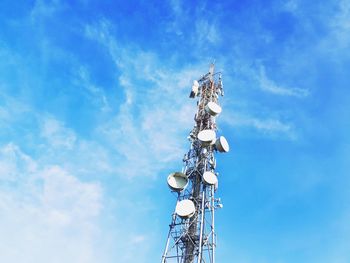 Low angle view of communications tower against sky